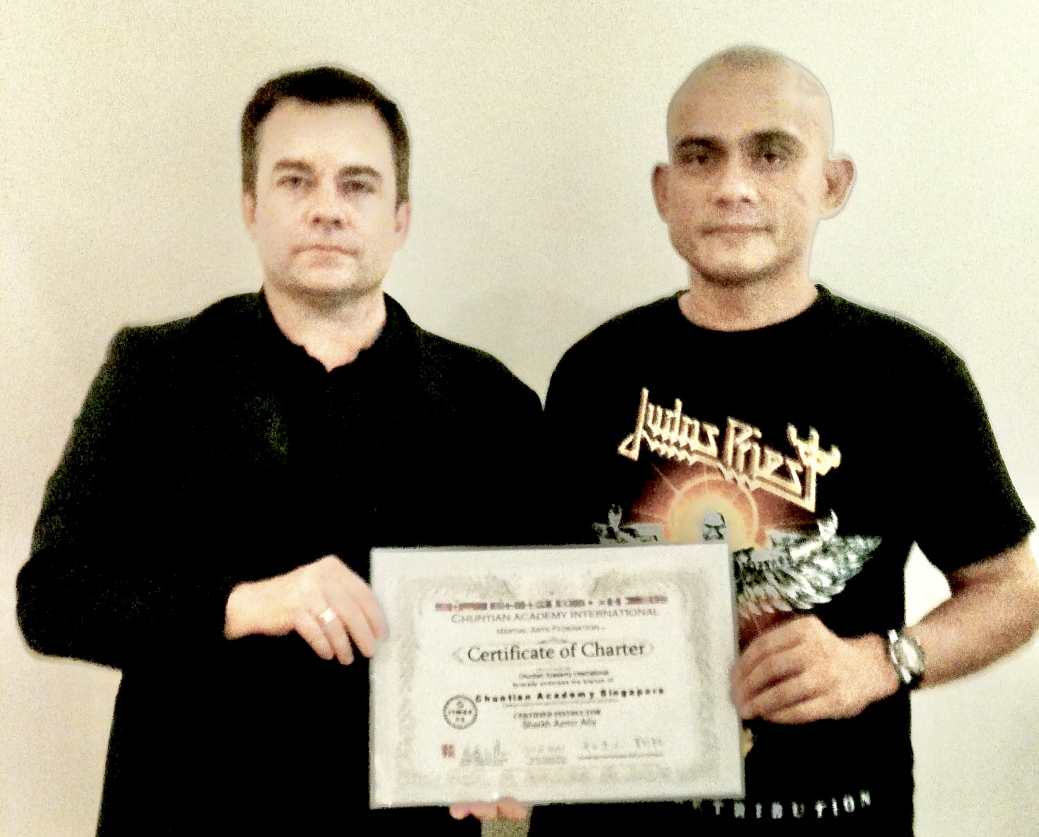 Master Plewes in Singapore granting a school charter to Sheik Azmir after government Martial Arts and Security Approval